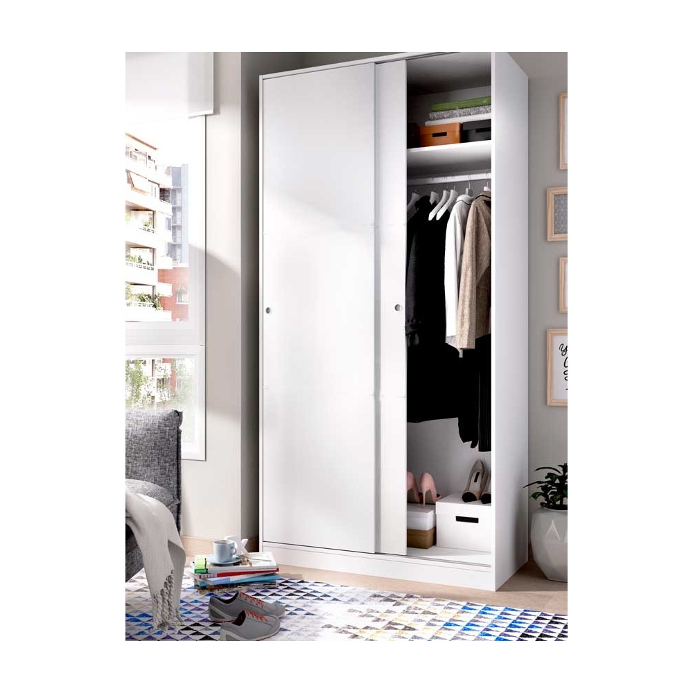Wardrobe closet measuring 100 x 50 with shelf and hanging rod. Sliding doors to save space.