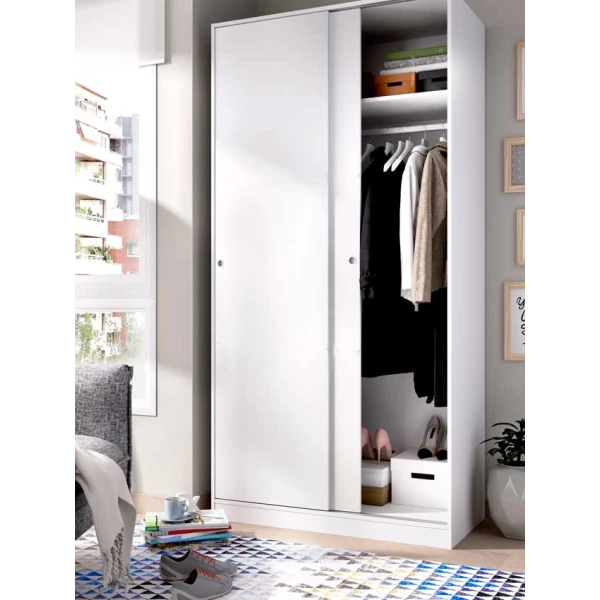Wardrobe closet measuring 100 x 50 with shelf and hanging rod. Sliding doors to save space.